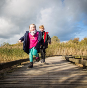 Children on boardwalk at RSPB Conwy